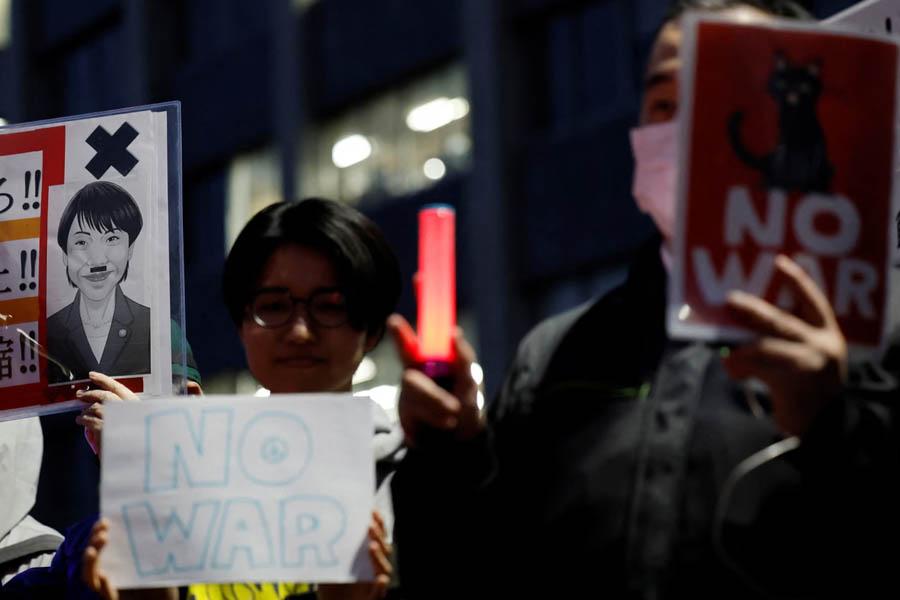Anti-war demonstrators in Tokyo protesting Japan’s potential involvement in the Strait of Hormuz conflict before Prime Minister Sanae Takaichi’s meeting with US President Donald Trump.