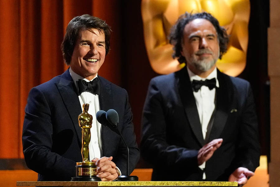 Tom Cruise receiving an honorary award from filmmaker Alejandro González Iñárritu at the Governors Awards.