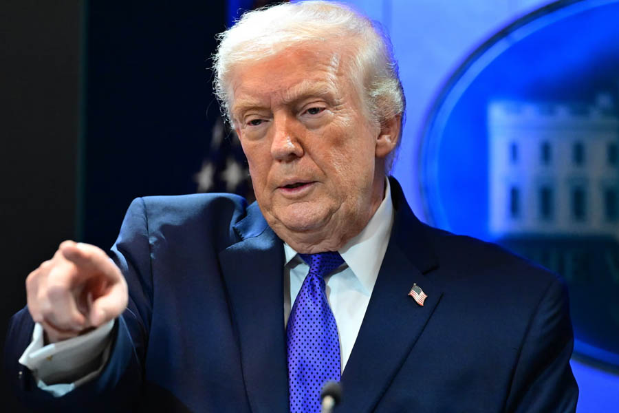 Donald Trump delivering remarks at the White House on February 20, 2026, announcing a 15% tariff on imports from all countries following a Supreme Court ruling.