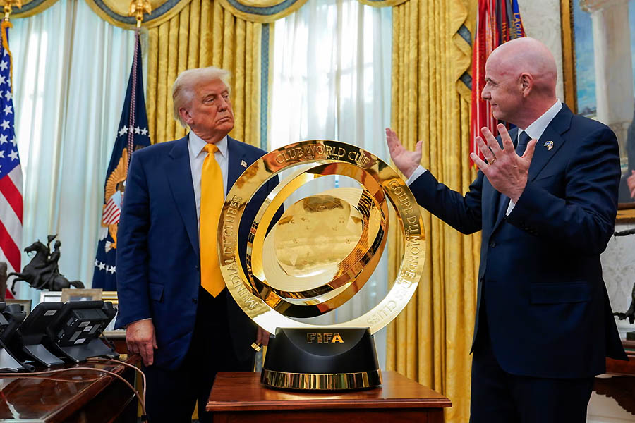 Donald Trump with Gianni Infantino and the Club World Cup in the White House.