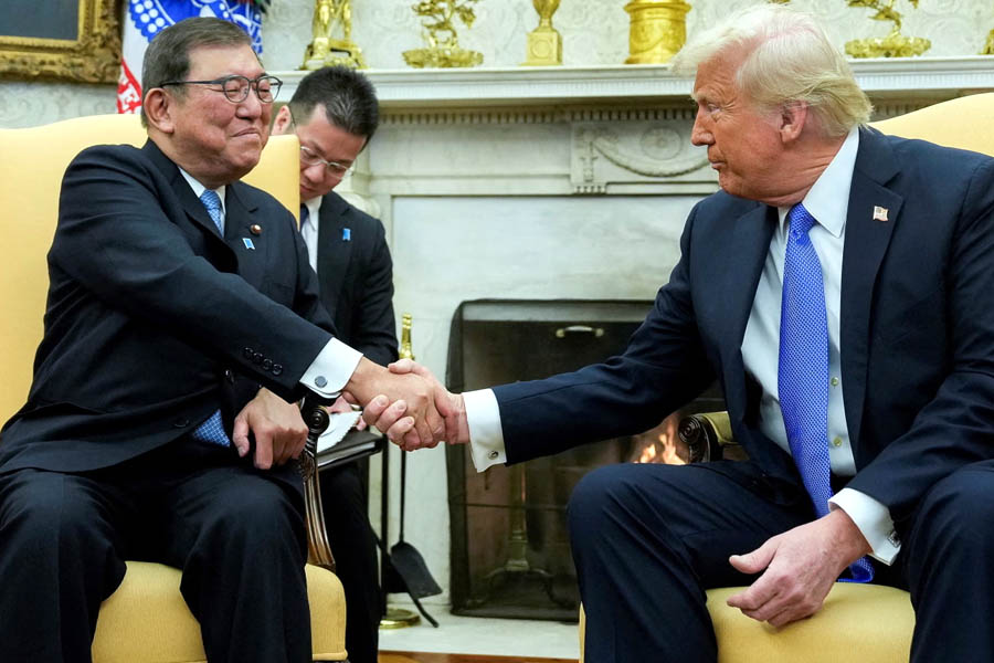 President Donald Trump announces a $550B trade deal with Japan as Prime Minister Shigeru Ishiba faces growing calls to resign amid economic and political turmoil.