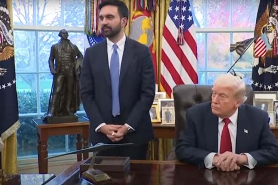 Donald Trump and Zohran Mamdani standing side by side in the Oval Office during a news conference, speaking to reporters about their newly formed partnership on New York’s economic and housing challenges.