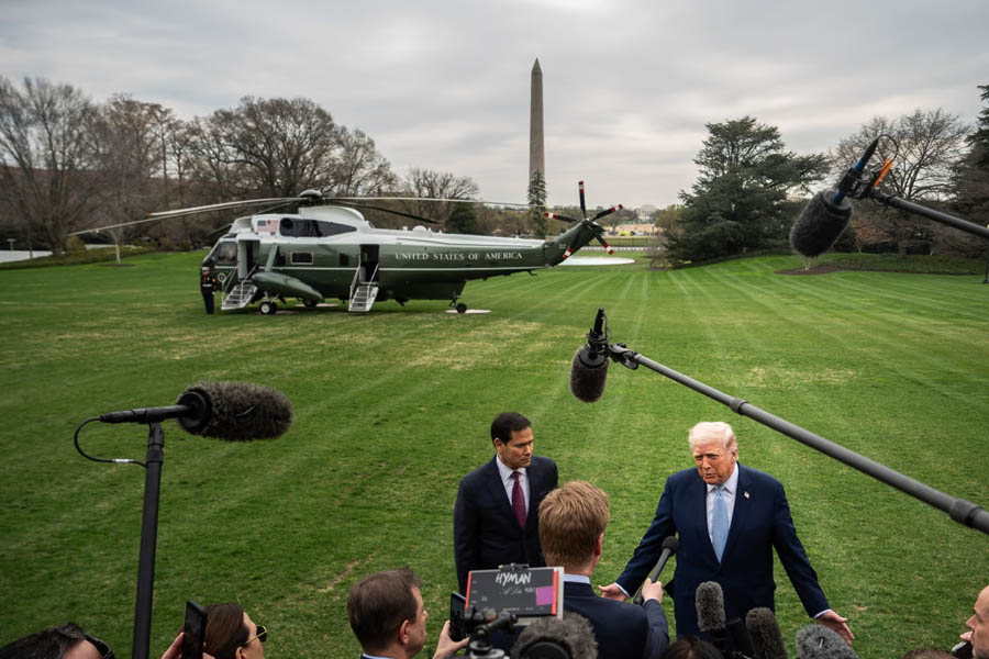Donald Trump and Marco Rubio addressing reporters outside the White House before departure.