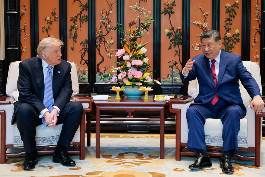 Donald Trump and Xi Jinping walk through the gardens of Beijing’s Zhongnanhai leadership compound during the final day of their summit.