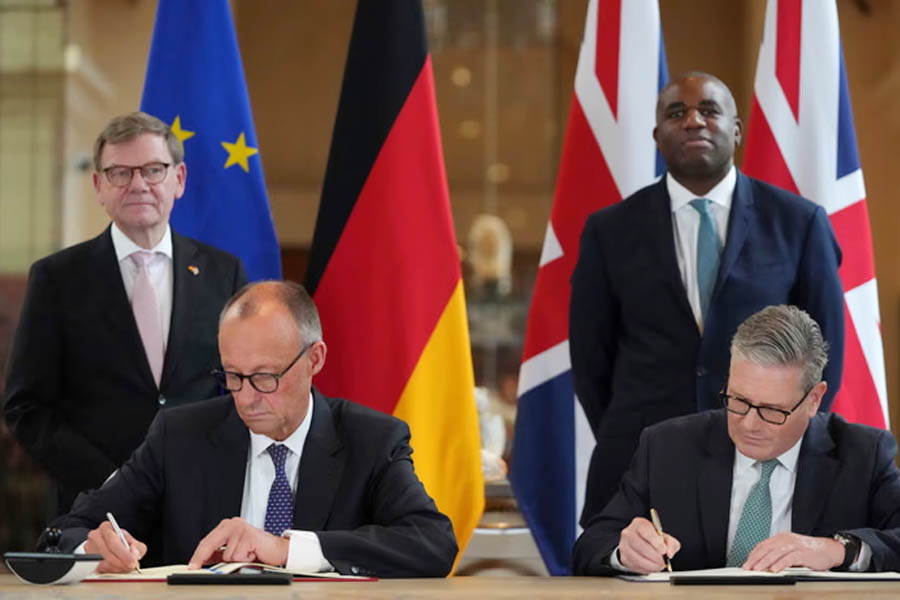 UK Prime Minister Keir Starmer and German Chancellor Friedrich Merz sign the Kensington Treaty at London's V&A Museum, marking a new chapter in UK-Germany relations.
