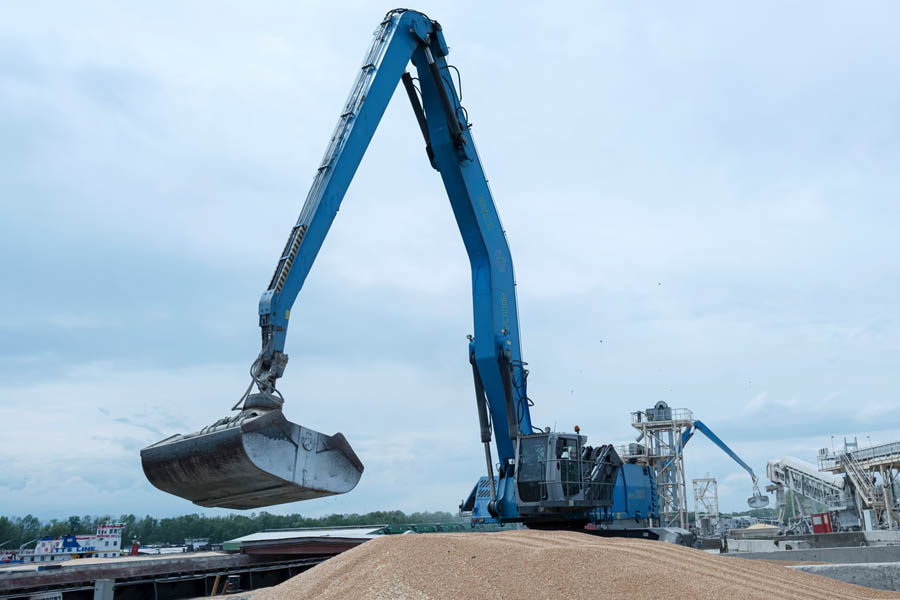 An excavator loads grain onto a cargo vessel at the port of Izmail as Ukraine accuses Russia of exporting grain taken from occupied territories.