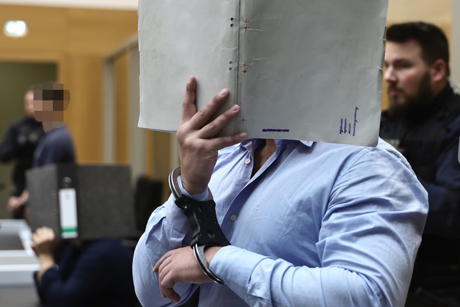 A Ukrainian defendant arrives before the court during his trial at the Higher Regional Court in Stuttgart, Germany.