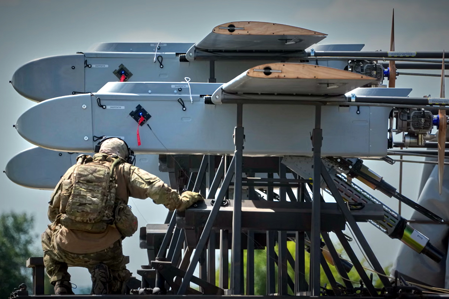 A soldier prepares Ukrainian FP-1 long-range attack drones for a deep-strike into Russia. Volodymyr Zelenskyy has warned Russian skies are no longer safe for planes because of Ukrainian drones.