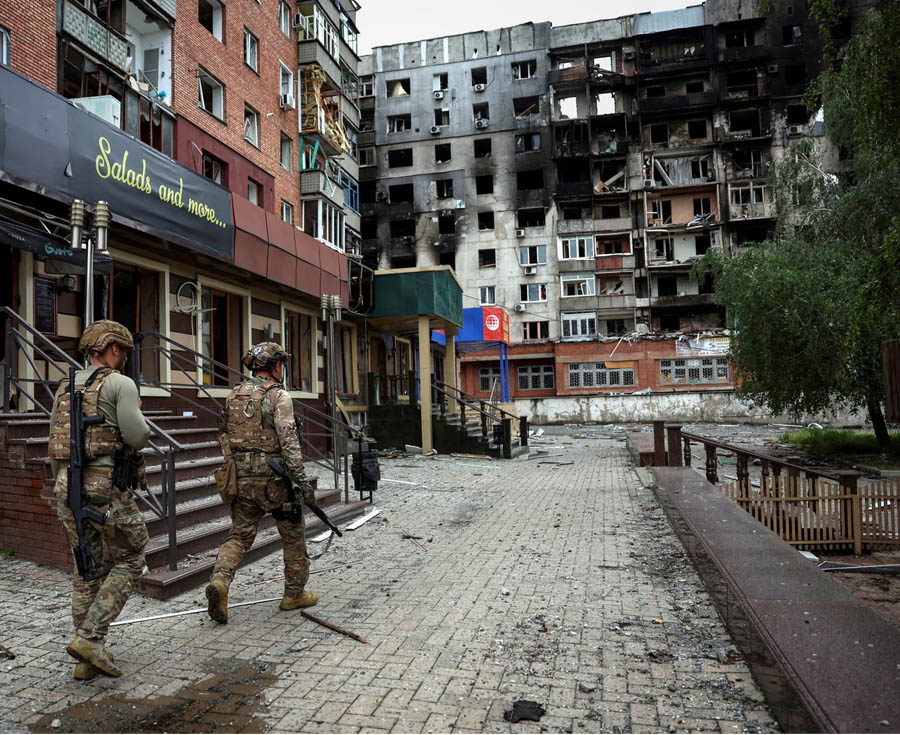 Ukrainian police officers help residents evacuate from Pokrovsk in the Donetsk region amid ongoing fighting, as President Zelenskyy reports defensive positions holding near Dobropillia.