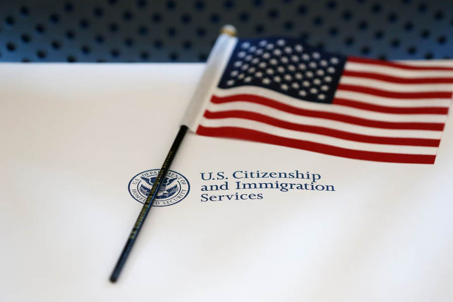 An information packet and a US flag are placed on a chair at the US Citizenship and Immigration Services Miami field office.