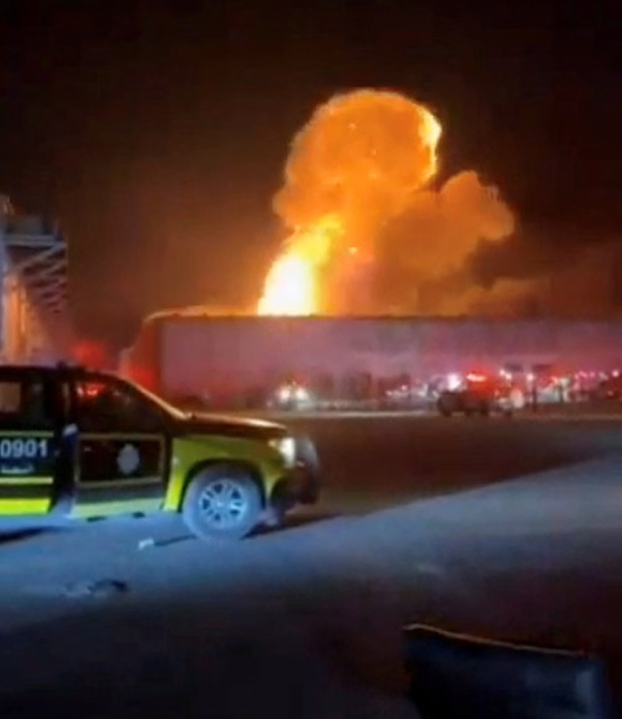 Smoke rises from an explosion following a drone strike on a warehouse in Kuwait. The IRGC claimed it struck a US army logistics centre in Mina Abdullah.