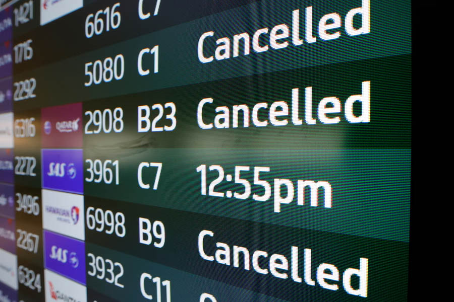Crowded airport terminal in Charlotte, North Carolina, during mass flight cancellations linked to U.S. federal government shutdown.
