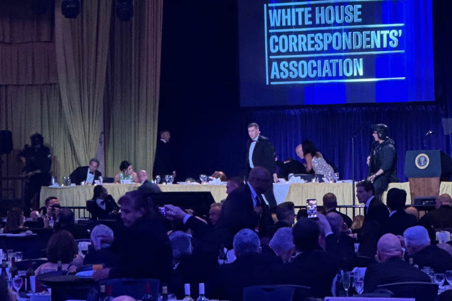 US Secret Service agents rush into action after gunshots were reported during the White House Correspondents' Dinner at the Washington Hilton, where President Donald Trump was attending before being evacuated.