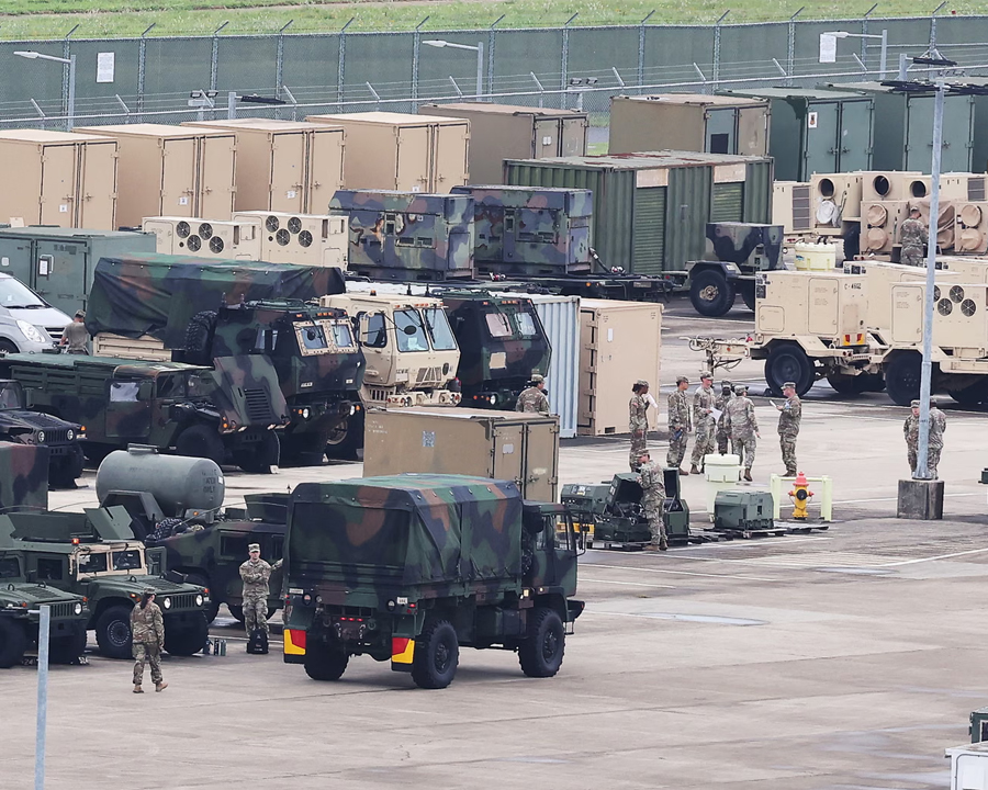 US soldiers are seen near military vehicles at Camp Humphreys in Pyeongtaek on 17 August 2026.