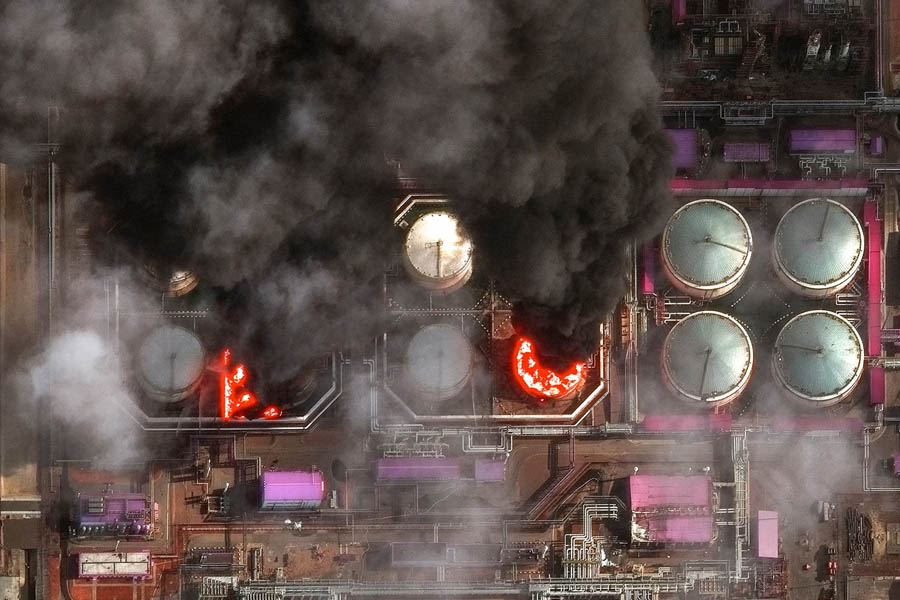 A satellite near-infrared image shows smoke rising from oil storage tanks at Russia's Baltic Sea port of Ust-Luga on 29 March 2026.