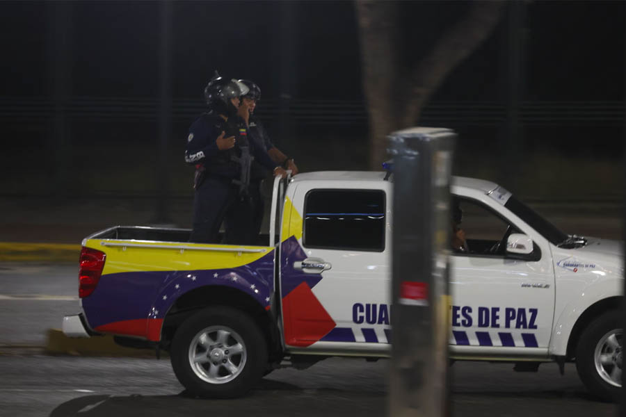 Venezuelan security forces conducting a vehicle patrol in Caracas following reports of multiple explosions across the city.