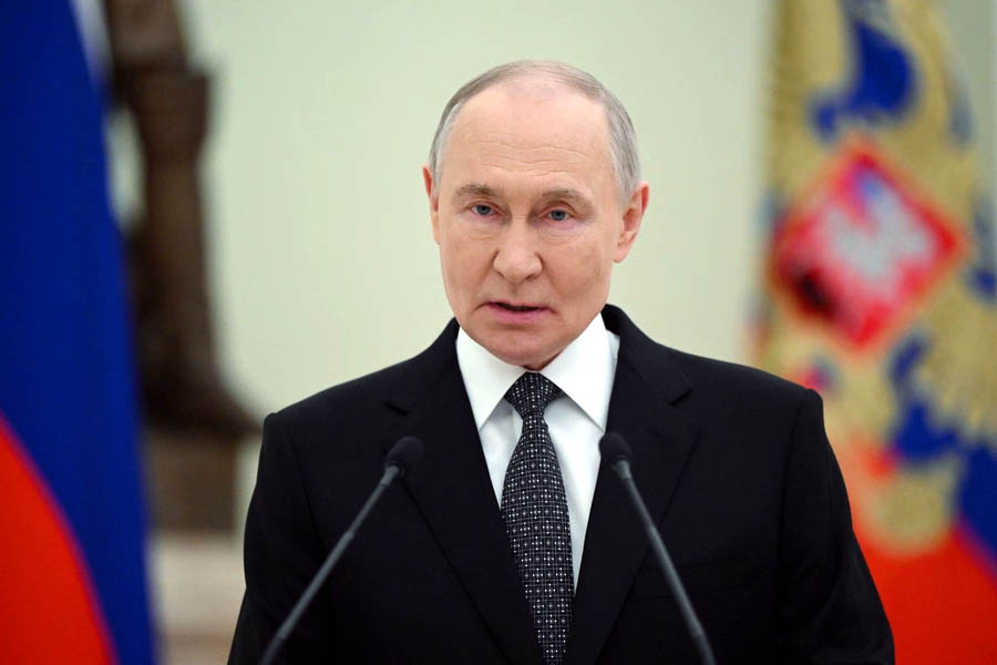 Vladimir Putin standing during a formal ceremony inside the Kremlin in Moscow, Russia, earlier this week.