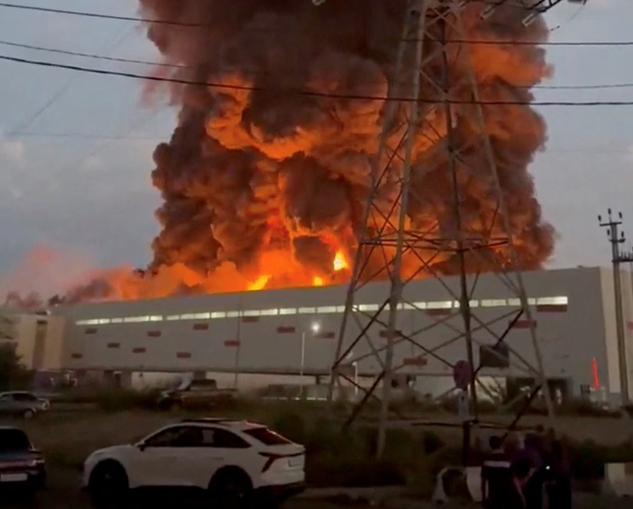 Smoke rises from a Wildberries warehouse on fire after an attack in Nevinnomyssk, Russia. Kyiv says the e-tailer supplies drone components and other equipment for the Russian war effort.