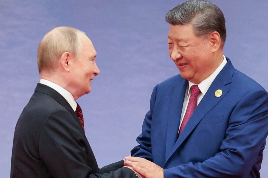 Chinese President Xi Jinping greets Russian President Vladimir Putin at the Shanghai Cooperation Organisation (SCO) summit in Tianjin, China, before the 2025 Victory Day military parade