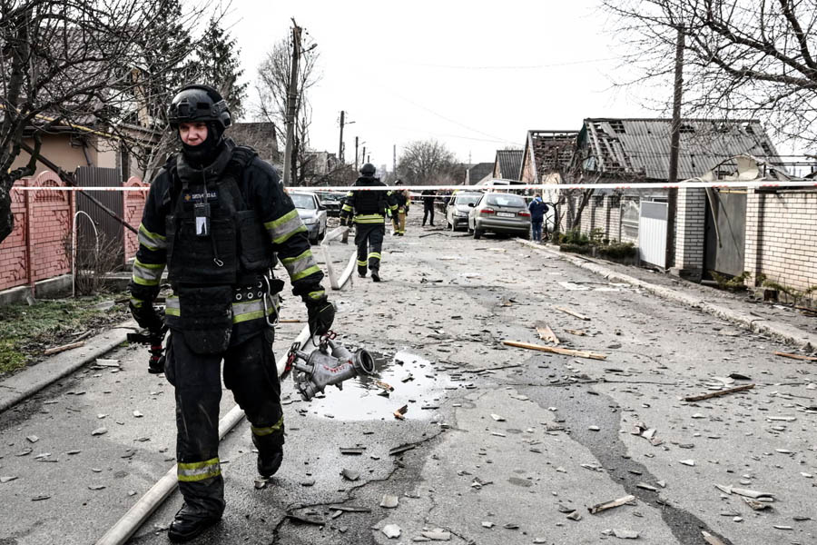 Firefighters at the scene of a Russian drone attack on a private residence in Zaporizhzhia, Ukraine, March 21, 2026.