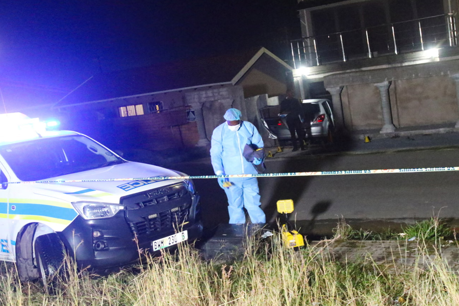A forensic pathologist outside the home of Zolani Tete after the fatal shooting in Mdantsane in the Eastern Cape province